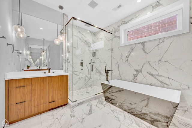 bathroom featuring visible vents, vanity, a marble finish shower, and stone wall