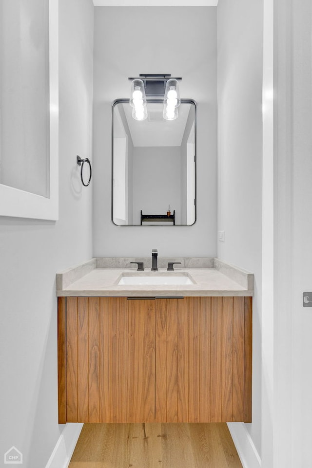 bathroom with baseboards and vanity