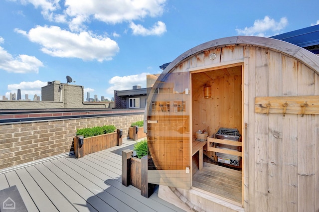 wooden terrace featuring a city view