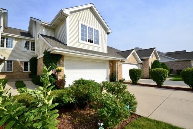 view of front of house featuring brick siding