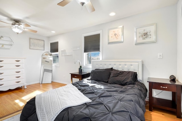 bedroom featuring baseboards, recessed lighting, a ceiling fan, and light wood-style floors