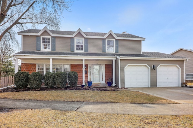 traditional home featuring driveway, a garage, and brick siding