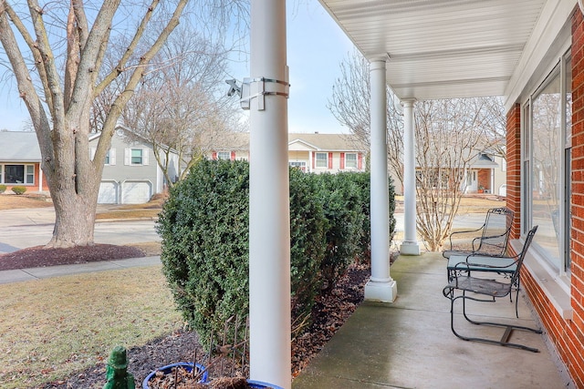 view of patio / terrace featuring covered porch and a residential view