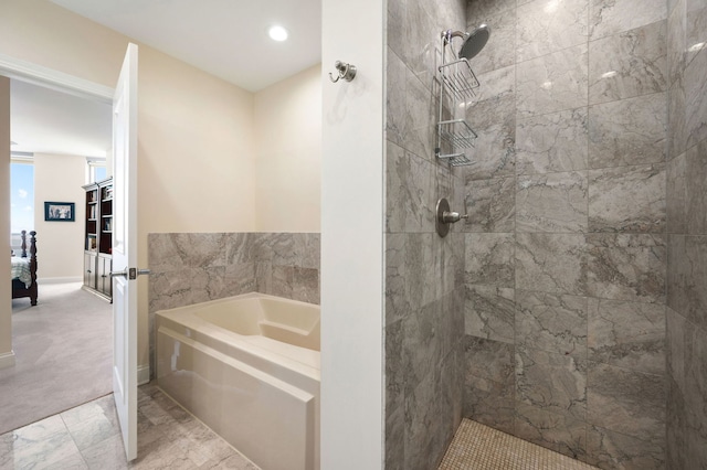 full bath featuring ensuite bath, tiled shower, and a garden tub