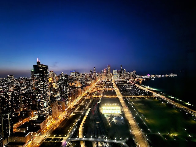 drone / aerial view of a view of city lights and a main thoroughfare