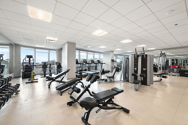 workout area featuring a paneled ceiling