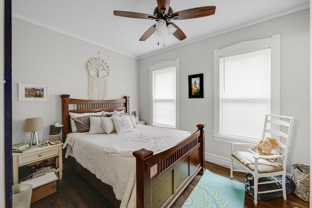 bedroom with crown molding, dark wood finished floors, baseboards, and a ceiling fan