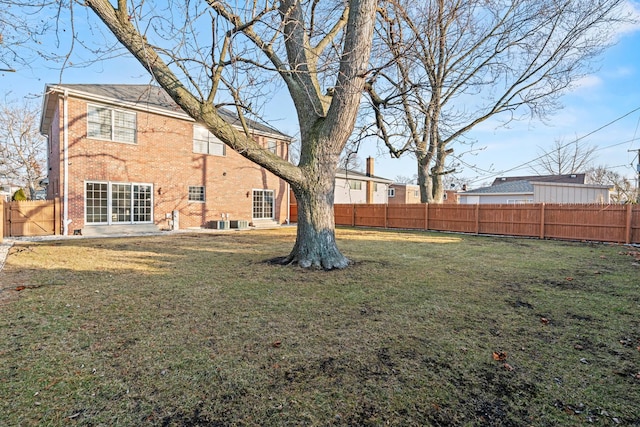 view of yard with a fenced backyard