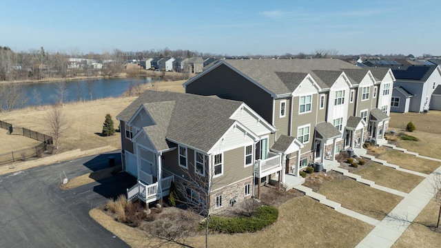 bird's eye view with a residential view and a water view