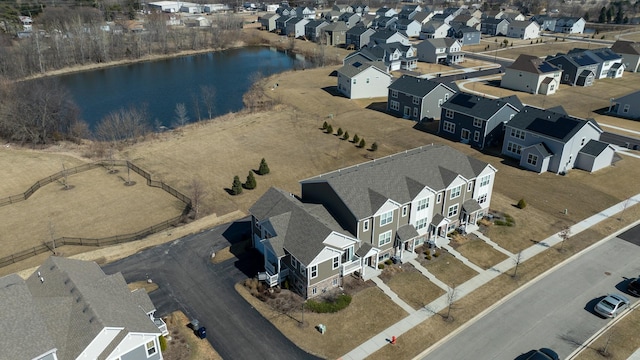 aerial view with a residential view and a water view