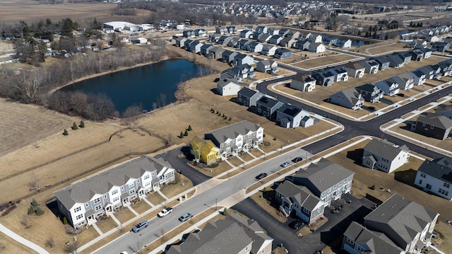 bird's eye view with a residential view and a water view