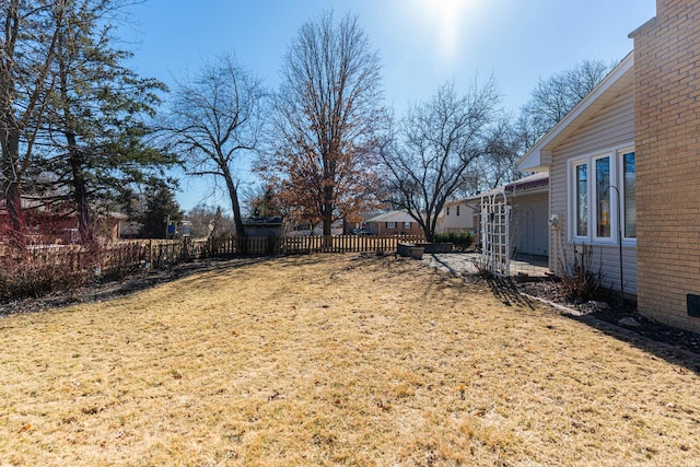 view of yard featuring a patio and fence