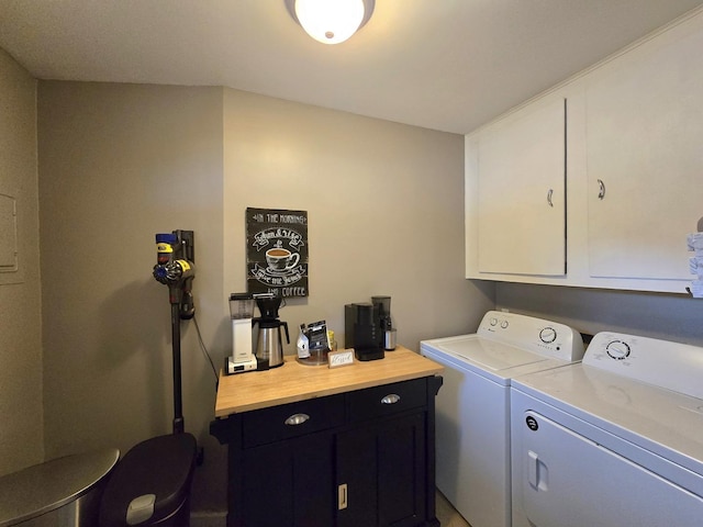 laundry area featuring cabinet space and washer and clothes dryer