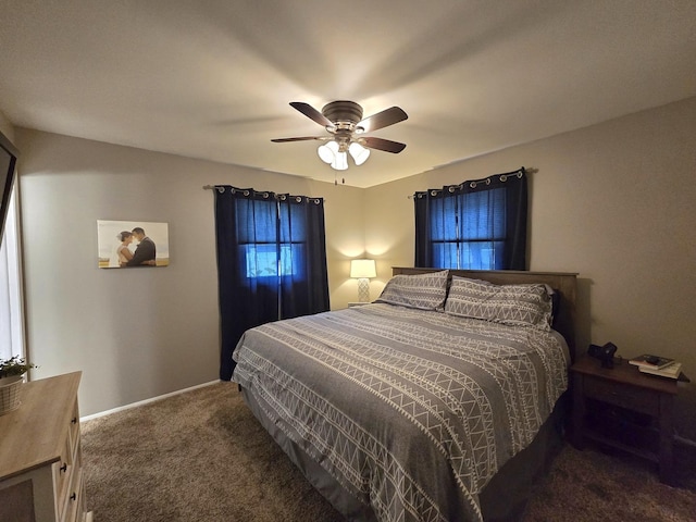 bedroom with a ceiling fan, carpet, and baseboards