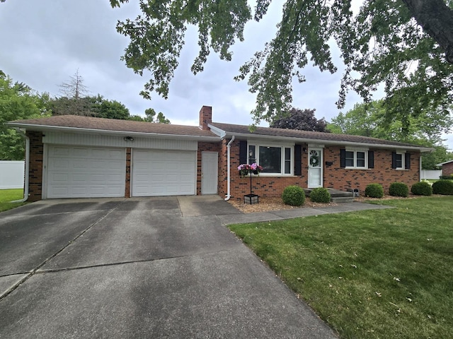 single story home with brick siding, a chimney, concrete driveway, an attached garage, and a front lawn