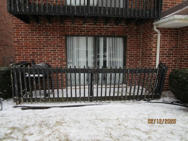 view of snow covered gate