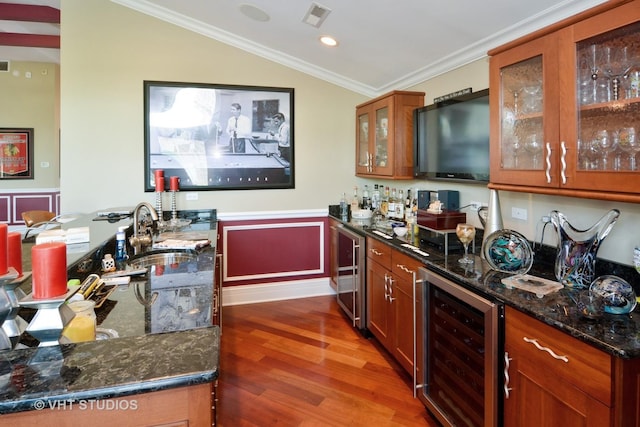 bar with a sink, indoor wet bar, wine cooler, and visible vents