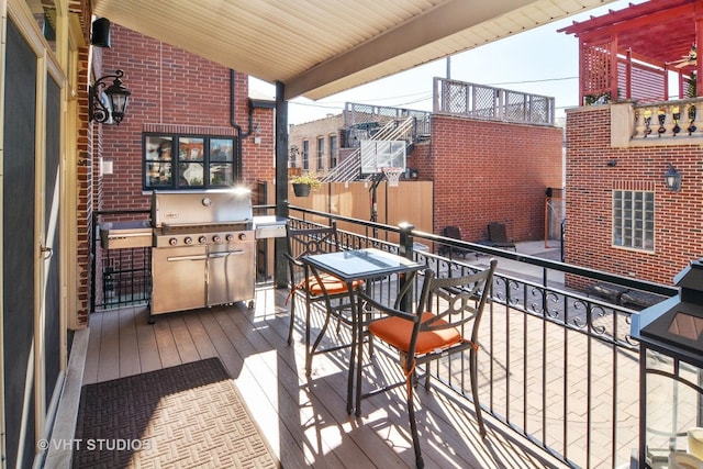 wooden deck with area for grilling