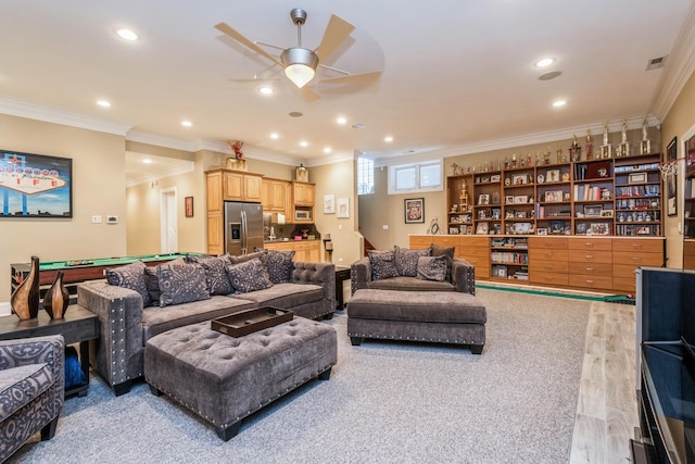 living room with wood finished floors, recessed lighting, ceiling fan, pool table, and ornamental molding