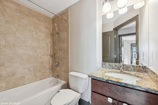 bathroom featuring toilet, shower / washtub combination, and vanity