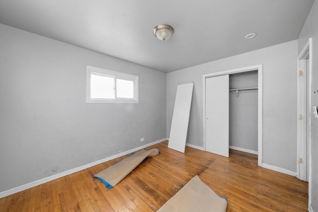 16159 Wood St, Markham, IL 60428 - unfurnished bedroom featuring baseboards, wood finished floors, and a closet