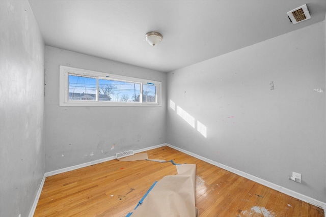 16159 Wood St, Markham, IL 60428 - empty room with wood finished floors and baseboards