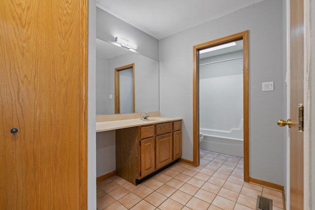 bathroom featuring tile patterned flooring, visible vents, baseboards, and vanity