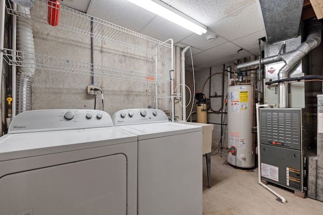 washroom featuring laundry area, separate washer and dryer, and gas water heater