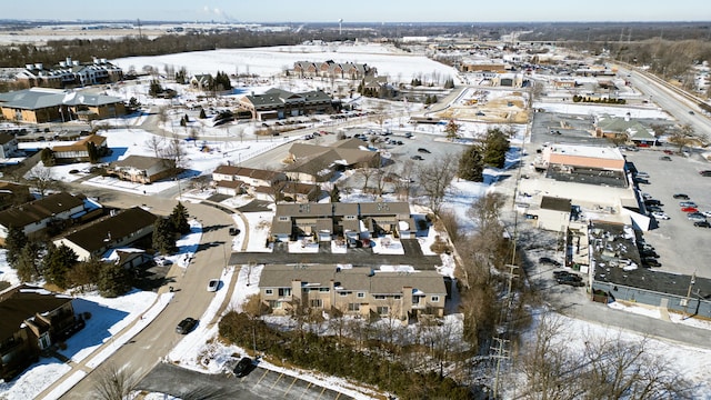 snowy aerial view featuring a residential view