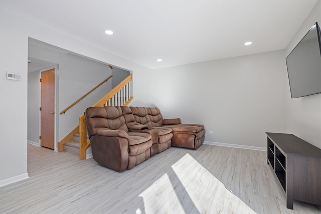 living area featuring stairway, recessed lighting, light wood-style flooring, and baseboards