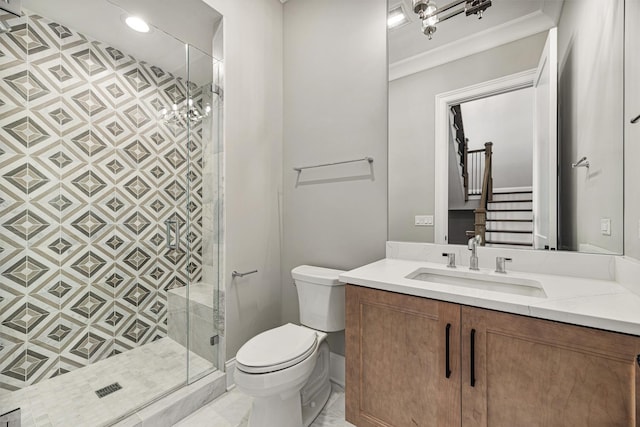 full bath with toilet, a stall shower, crown molding, and vanity