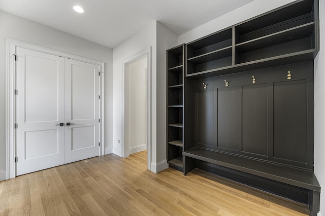 mudroom featuring recessed lighting, baseboards, and light wood finished floors