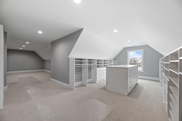 additional living space with lofted ceiling, baseboards, light colored carpet, and recessed lighting
