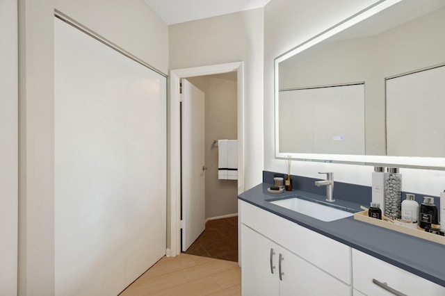 bathroom featuring vanity and wood finished floors