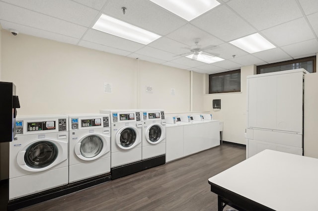 common laundry area with dark wood-type flooring, washing machine and dryer, and a ceiling fan