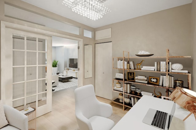 office area with light wood-type flooring and a notable chandelier