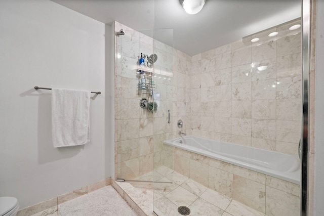 full bath featuring toilet, a stall shower, tile patterned flooring, baseboards, and a bath