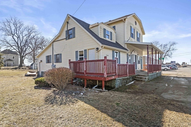 view of home's exterior with covered porch and roof with shingles