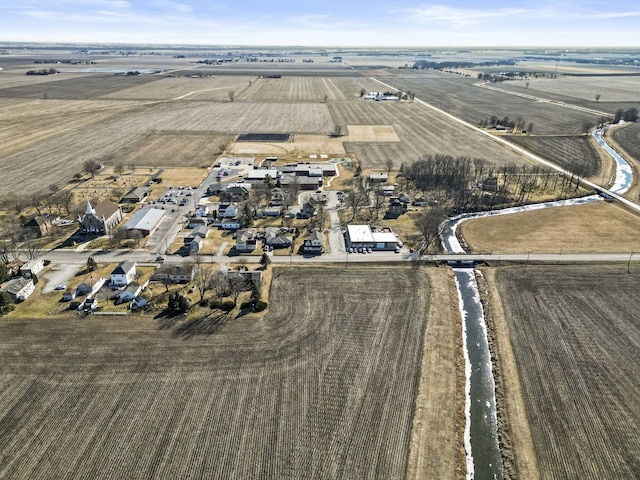 birds eye view of property with a rural view