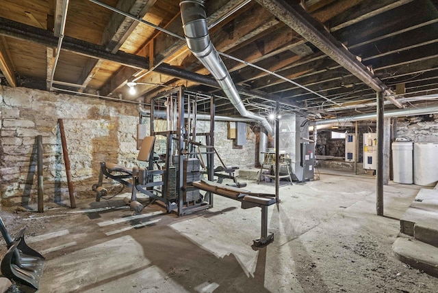 workout area featuring electric water heater and heating unit