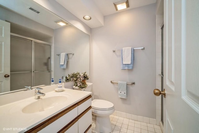 bathroom with tile patterned flooring, toilet, visible vents, baseboards, and a shower with door