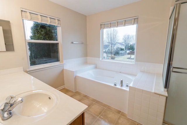 full bath with tile patterned flooring, a shower with door, vanity, and a bath