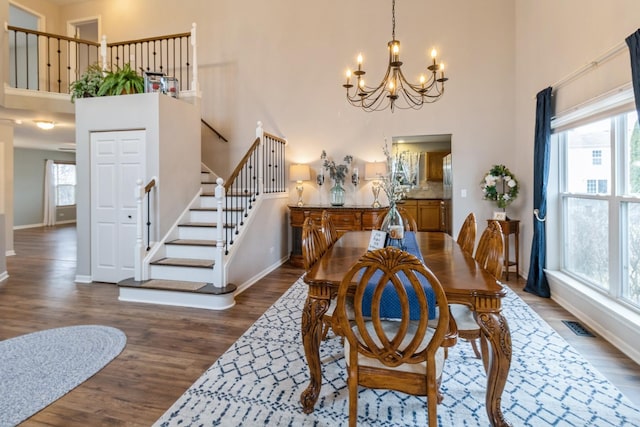 dining area with plenty of natural light, wood finished floors, and visible vents