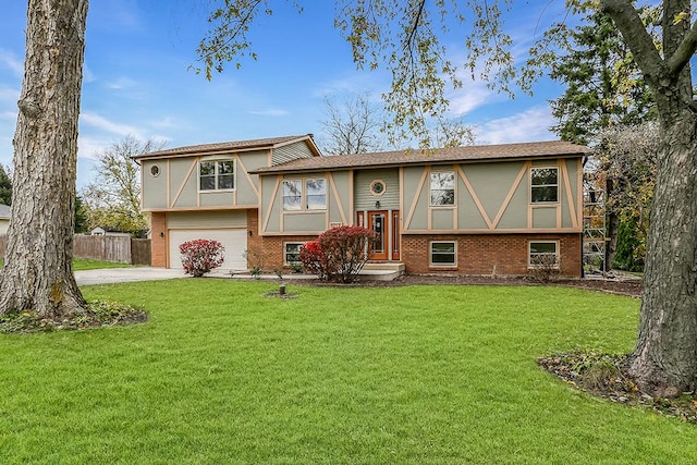 bi-level home featuring driveway, brick siding, an attached garage, a front yard, and stucco siding