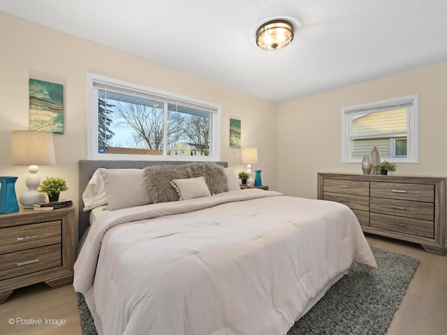 bedroom featuring light wood finished floors