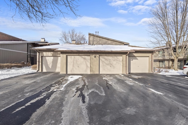 view of snow covered garage