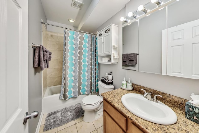 bathroom featuring visible vents, vanity, toilet, and shower / bath combo with shower curtain