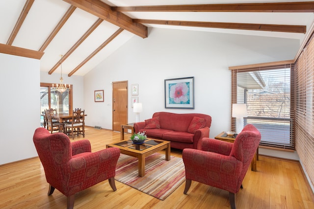 living room featuring light wood finished floors and beam ceiling