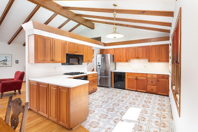 kitchen with brown cabinetry, a peninsula, black appliances, light countertops, and pendant lighting