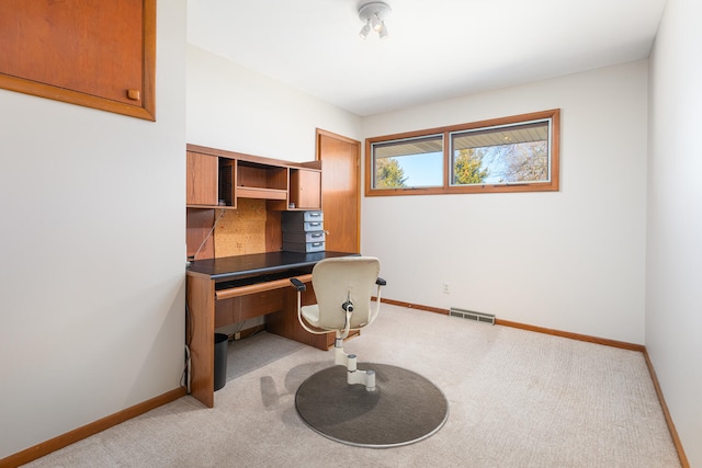 office featuring visible vents, baseboards, and carpet floors